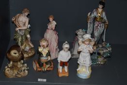 A selection of 19th Century and later figures including bisque, Royal Crown Derby owl etc