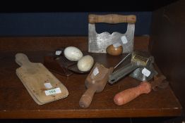 A selection of vintage kitchen items etc including butter pats, brooder eggs, treen scoop and Moulin
