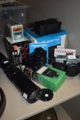 A selection of cameras and equipment including Praktica, Hanimex and Soligor zoom lens