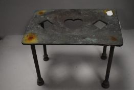 A traditional fire side trivet brass cast