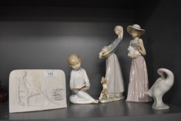 Four Lladro figures and a collector's society plaque