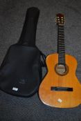 A junior Spanish acoustic guitar.