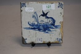 A 18th century Dutch delft tile depicting a mythical sea creature