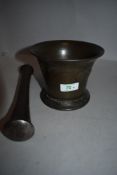 A Victorian bronze pestle and mortar, marked with crown