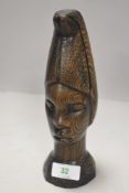 An African ethnic hard wood carved figure head of a female