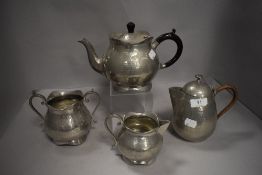 An Arts and Crafts style pewter tea set