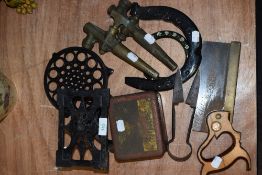 A selection of vintage tools and other items including small pair of shears, horse shoes, trivet and