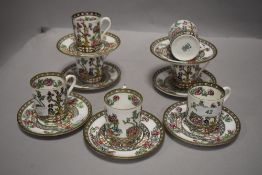 A set of seven early 20th Century Coalport coffee cans and saucers, Indian tree transfer print