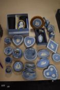 An assortment of Wedgwood to include pin dishes,table top lighters,perfume bottle and more.