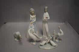 A selection of Lladro and similar figures including ducks/geese and ladies