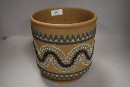 A Doulton Lambeth Silicon ware jardiniere having raised swag and fan decoration, height approx.