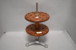 A mid century laboratory revolving test tube or pipette rack