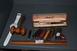 A selection of penknives, parker 61 pen, swatch watch and a wooden gavel