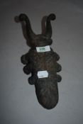 A cast iron beetle shaped boot remover.