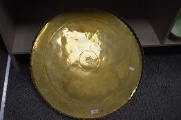 A large brass Indian style table top or wall plaque