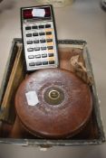A vintage Texas instruments calculator,a folding box wood rule and a tape measure.