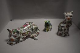 Two 20th century Chinese pottery Famille Rose cat figures with six character marks to base and