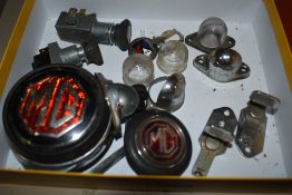 A selection of MG parts to include badges, number plate light fittings,switches and more.