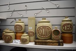 A selection of mid century kitchen storage jars including Hornsea pottery and Tremar