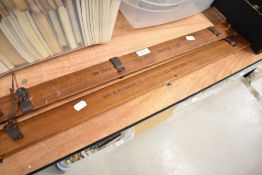 Two vintage Avecta trouser press in pitch pine with printed advertisment