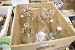 Four glass demijohns