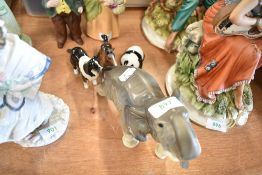 A selection of figurines including Beswick Panda and Foal with a West German made Elephant figure