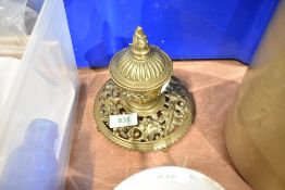 A Victorian brass ink well having lead liner and ornate styling.AF.