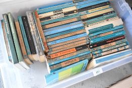A selection of text library and reference books including Pelican books
