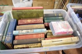A selection of text library and reference books including Harry Potter cassette tapes