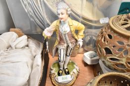 A 20th century porcelain figure of a Georgian man bearing a similar Meissen mark to base