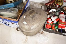 A large tin cooking pan with stand