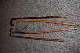 A selection of vintage walking canes/sticks.