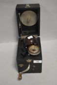 A miniature portable shellac record player gramophone by Peter Pan complete with horn and handle