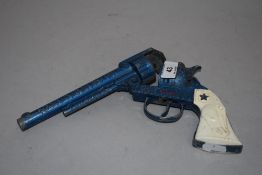 A childrens toy cow boy gun by Lone Star Night Rider