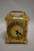 A vintage smiths mantel clock having roman numerals to face and etched designs to face and sides,