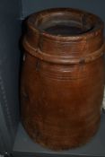 A large one piece carved wood bucket or grain bin