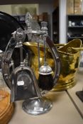 An antique helmet style coal bucket having hammered brass finish