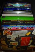 A collection of Guiness book of records volumes.