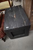 A painted pine tool chest, of hinged rectangular form with planked construction.