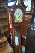 A modern long case clock in mahogany case