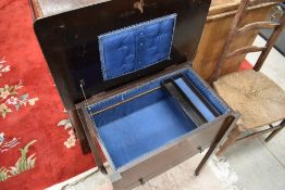An early 20th Century oak and ply sewing table/trolley