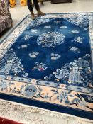 A Chinese carpet square, having blue ground, approx. 310 x 245cm, some marks and fading