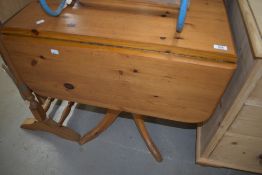 A modern pine pedestal table having drop leaves, turned column and quadruple splay legs , width