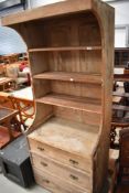 A pine cabinet, formally the interior of a wardrobe section