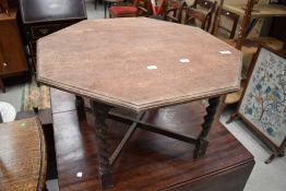 A 1940's octagonal oak coffee table, with barley twist supports.