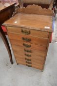 A Victorian stained frame seven drawer narrow chest , adapted from music cabinet with fixed drawer