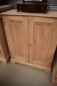 A 19th Century stripped pine shallow cabinet, width approx. 83cm D36cm, no handle