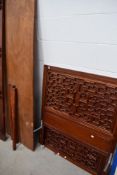 An Oriental hardwood single bed