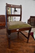 A set of four 19th Century rail back dining chairs