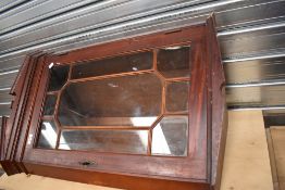 A reproduction mahogany corner wall display